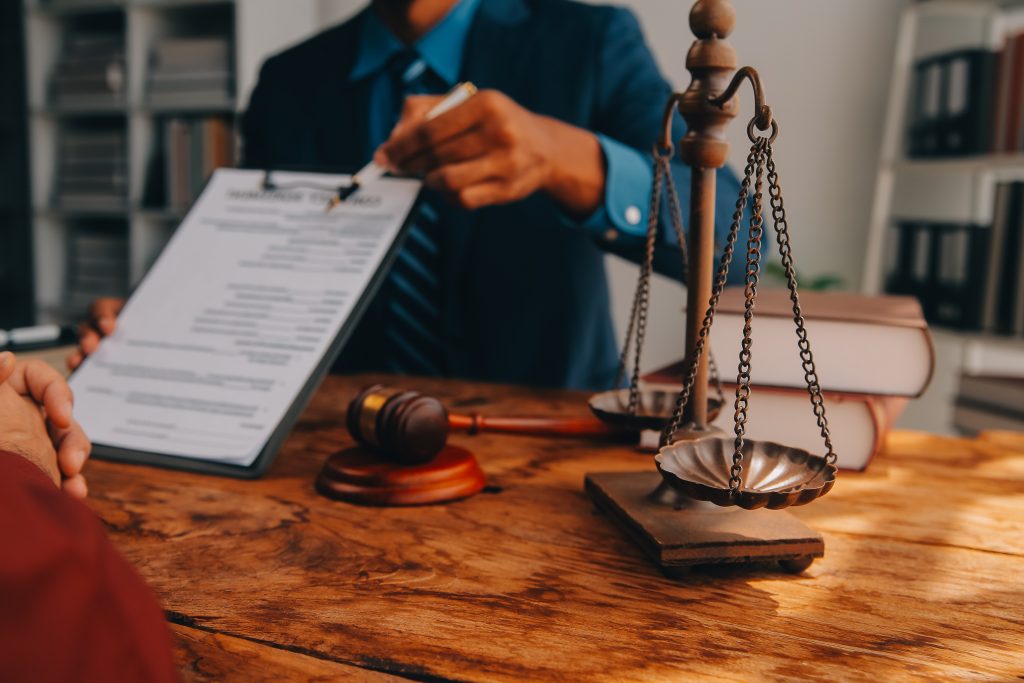 Lawyer handing a person a document